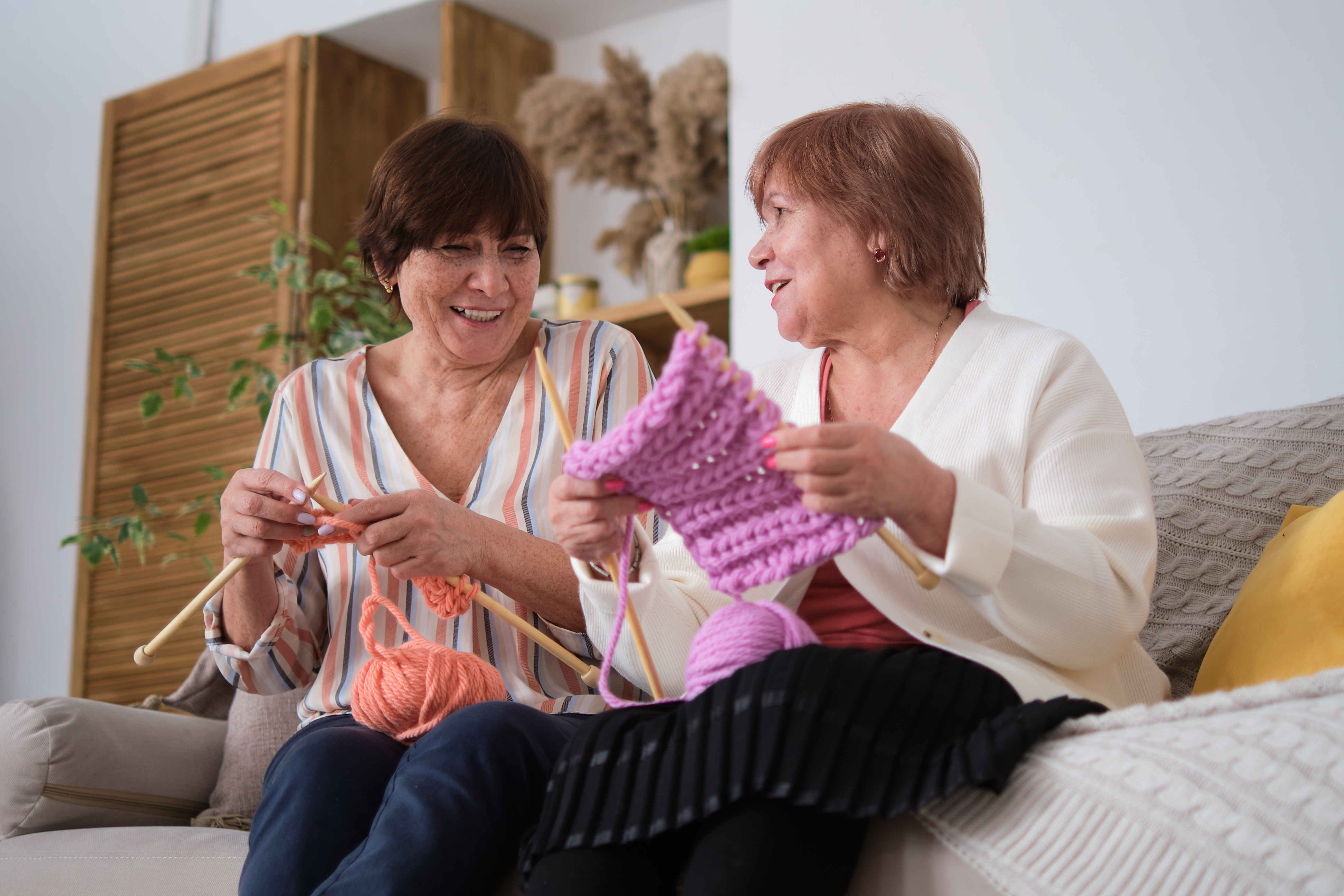 Engaged in heartfelt chatter and the soothing rhythm of knitting. Art of Knitting: Knitting serves